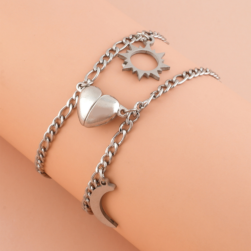 Coppia Bracciali in acciaio con ciondolo (mezzo cuore magnetico)