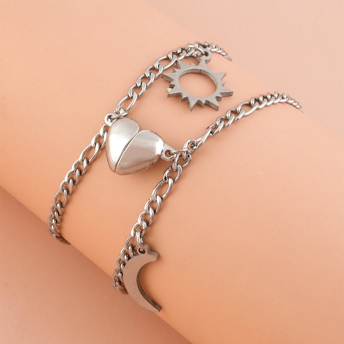 Coppia Bracciali in acciaio con ciondolo (mezzo cuore magnetico)