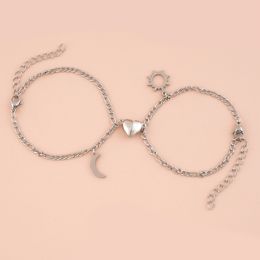 Coppia Bracciali in acciaio con ciondolo (mezzo cuore magnetico)
