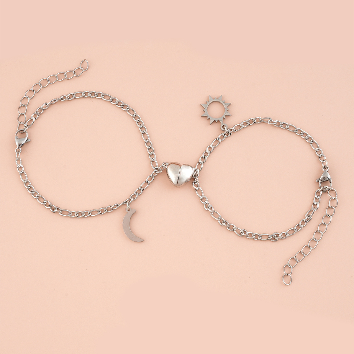 Coppia Bracciali in acciaio con ciondolo (mezzo cuore magnetico)